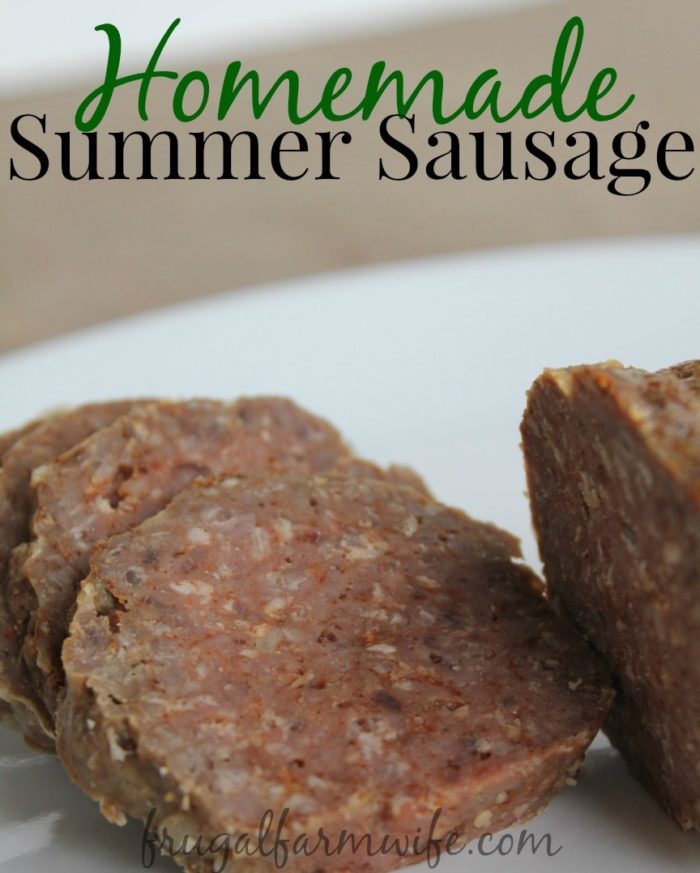 Image shows pieces of sausage sliced on a plate with the text "Homemade Summer Sausage"