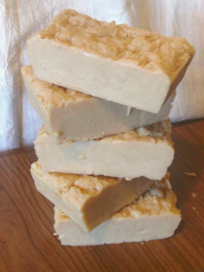 Image shows a stack of bars of handmade soaps