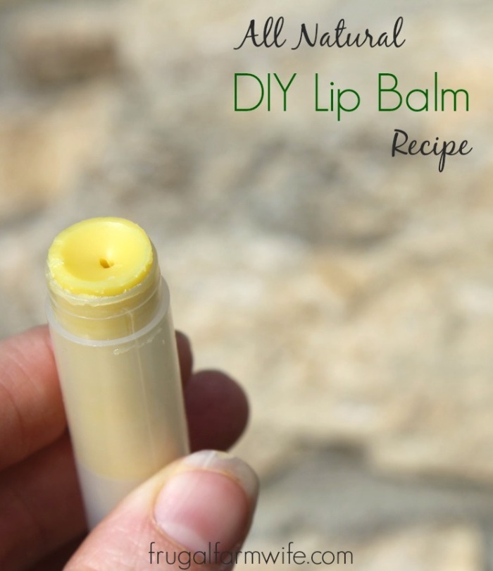 Photo shows a hand holding a tube of lip balm with text that reads "All Natural DIY Lip Balm Recipe"