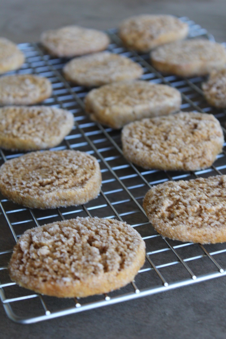 Image shows several rows of gluten free sweet potato cookies cooling on a wire cooling rack