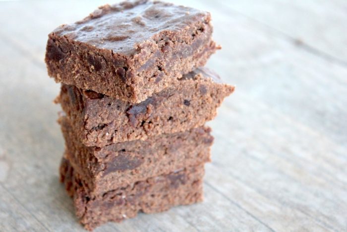 Image shows several brownies stacked on top of one another