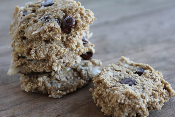 Image shows a stack of healthy oatmeal cookies on a table 