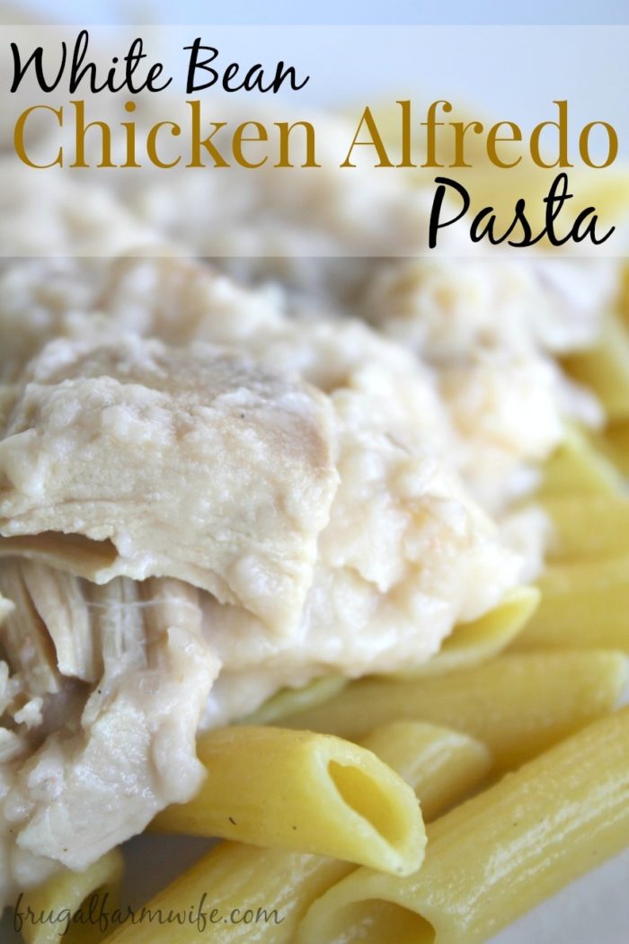 Image shows a close up of pasta with chicken and yet that reads "white bean chicken alfredo pasta"