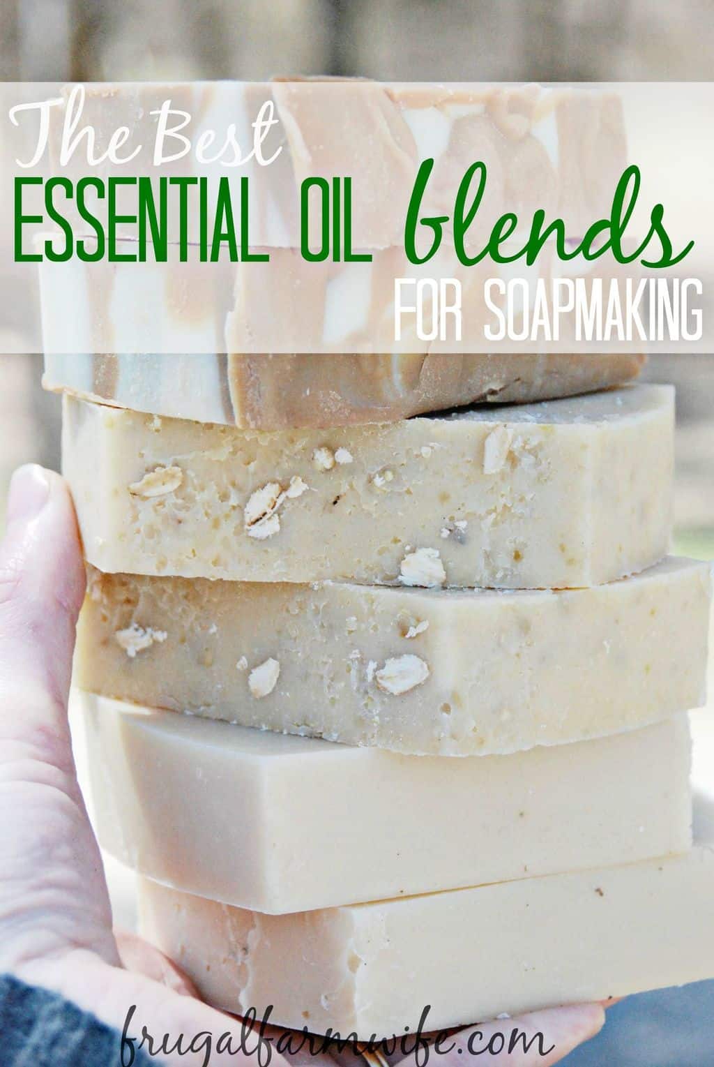 Image shows seven bars of homemade soap being held in a hand with text overlay that reads "The Best Essential Oil Blends for Soapmaking"