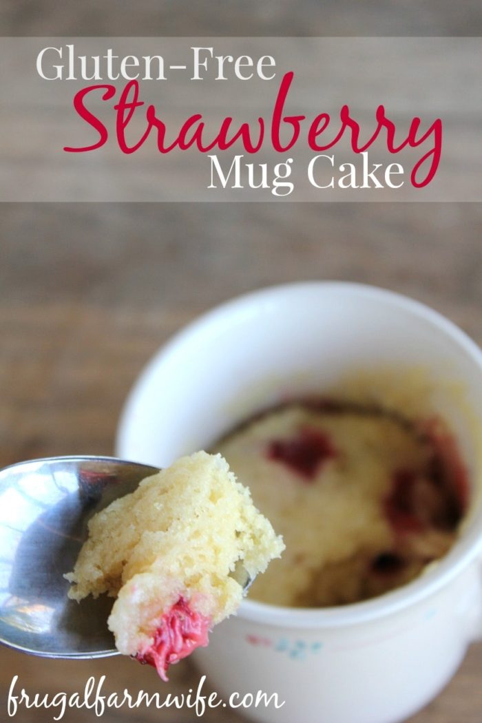 Image shows a mug of with a spoon of cake and text that says "Gluten-free strawberry mug cake"