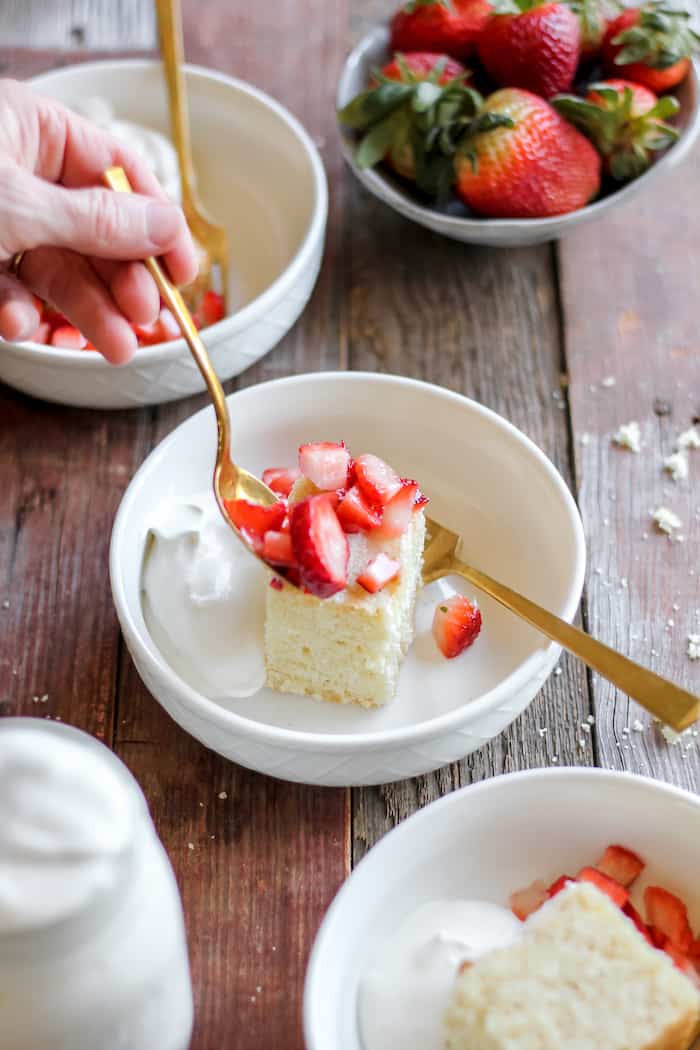 gluten-free shortcake topped with strawberries and whipped cream