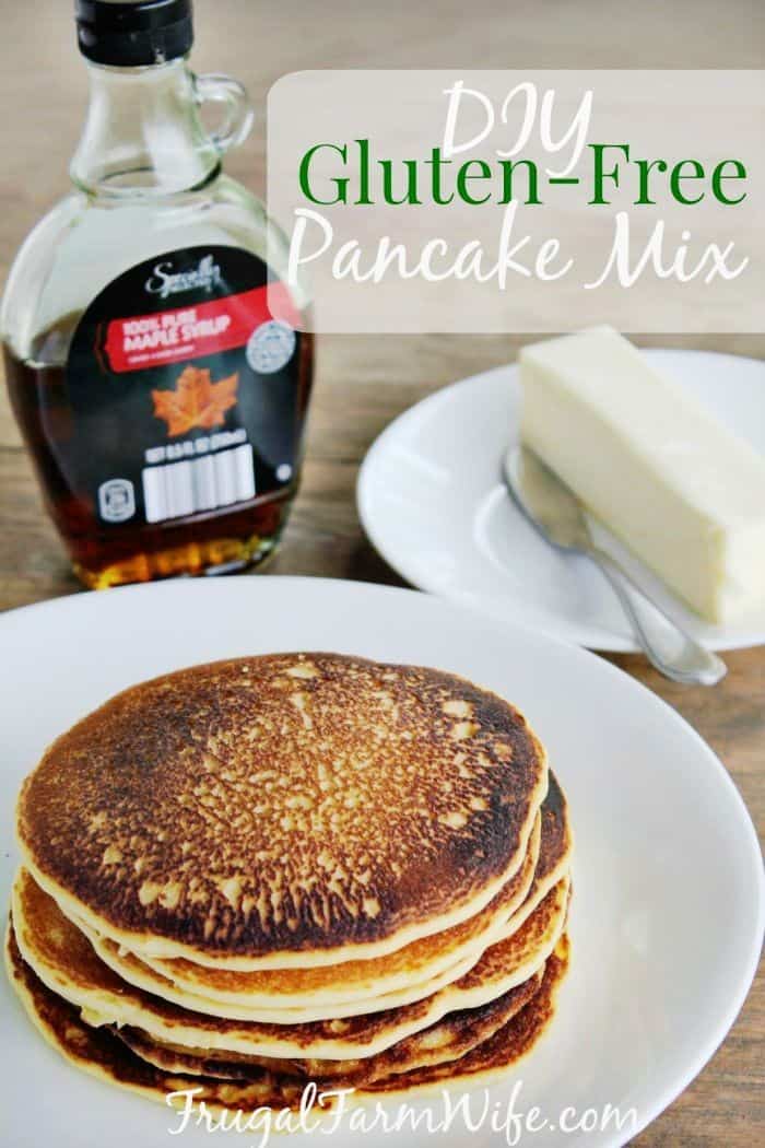 Photo shows a plate of pancakes next to a bottle of maple syrup, with text that reads "DIY Gluten-Free Pancake Mix"