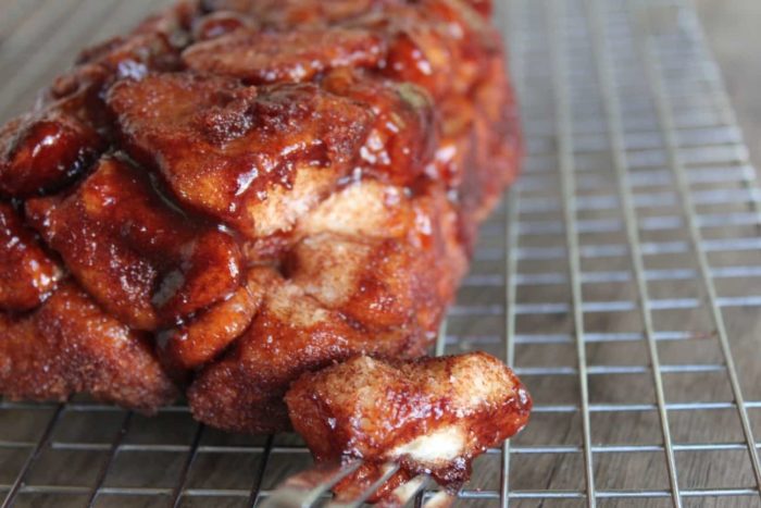 Image shows gooey monkey bread on a wire rack 