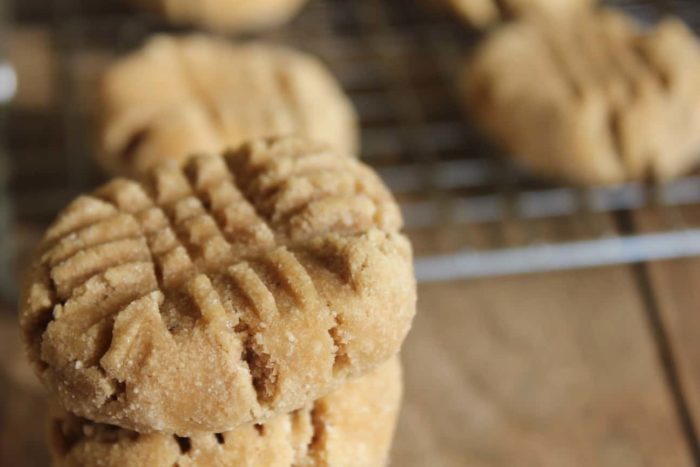 Photo shows several peanut butter banana cookies on a cooling rack