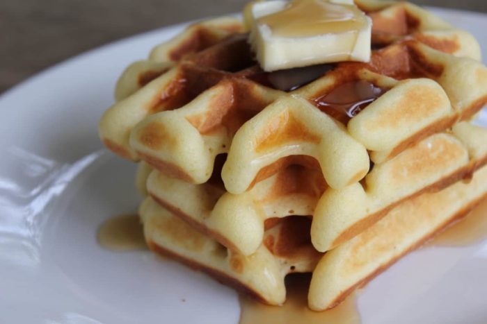 A pile of delicious Belgian Waffles on a plate