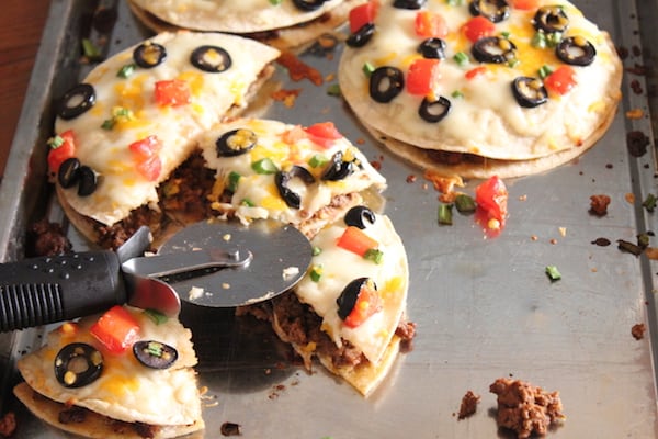 Image shows copycat Taco Bell Mexican Pizzas on a cookie sheet