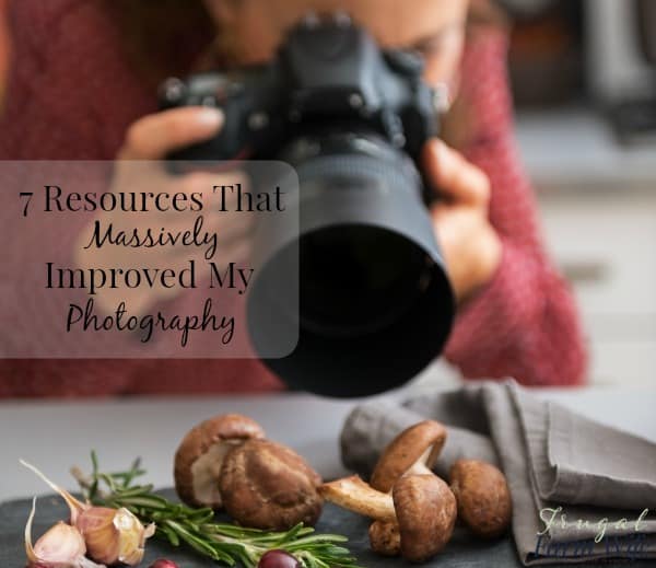 Image shows a woman taking a close up photo of mushrooms with text that reads "7 Resources That Massively Improved My Photography"
