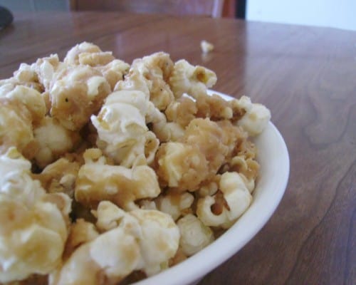 Photo shows a plate of popcorn on a table