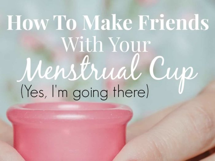 Image shows a hand holding a pink menstrual cup with text that reads "How to make friends with your menstrual cup (yes, I'm going there)"