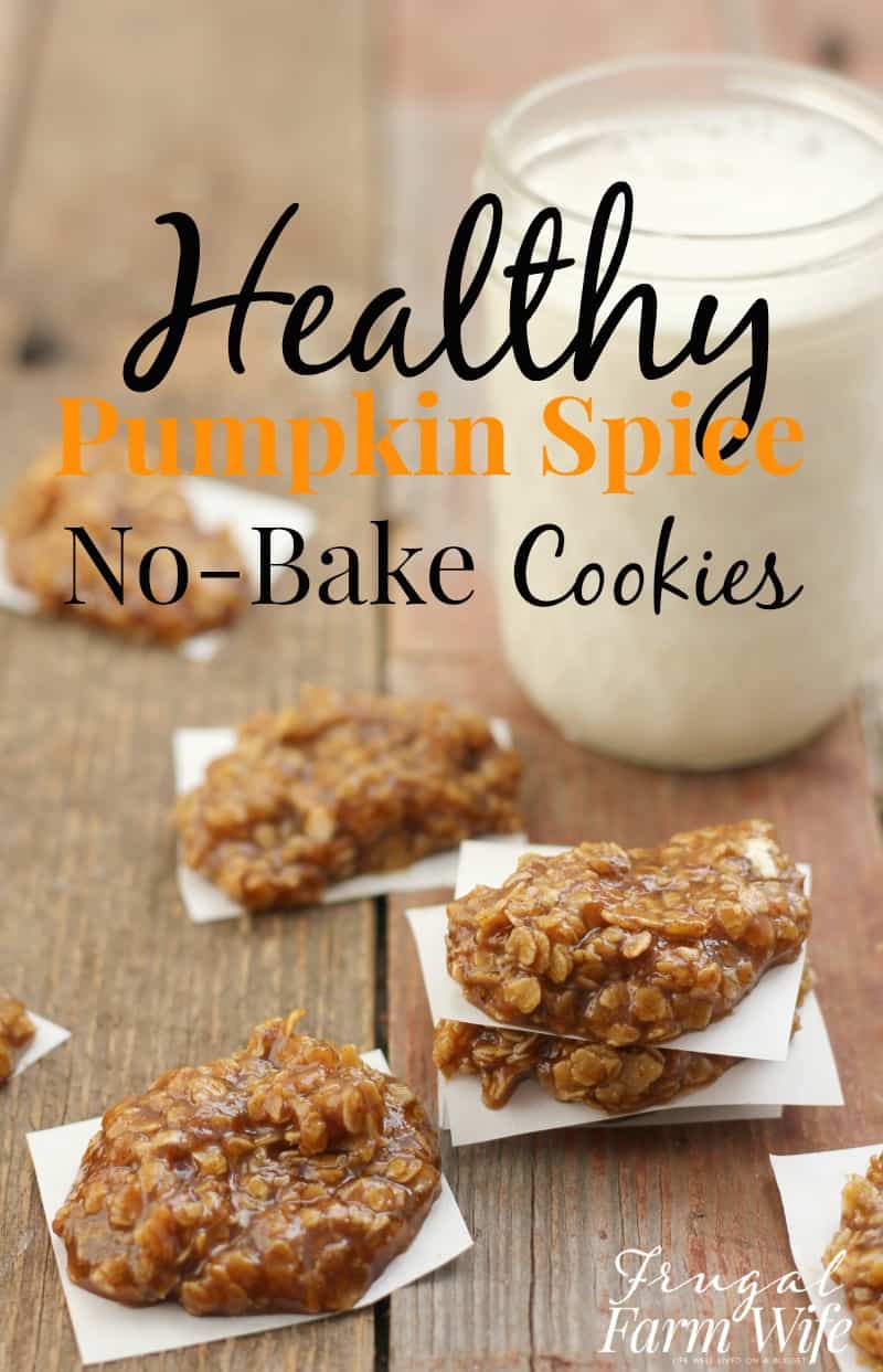 Image shows several small stacks of pumpkin spice no bake cookies on a table. Nearby sits a mason jar full of milk. Text overlay reads "Healthy Pumpkin Spice No-Bake Cookies"