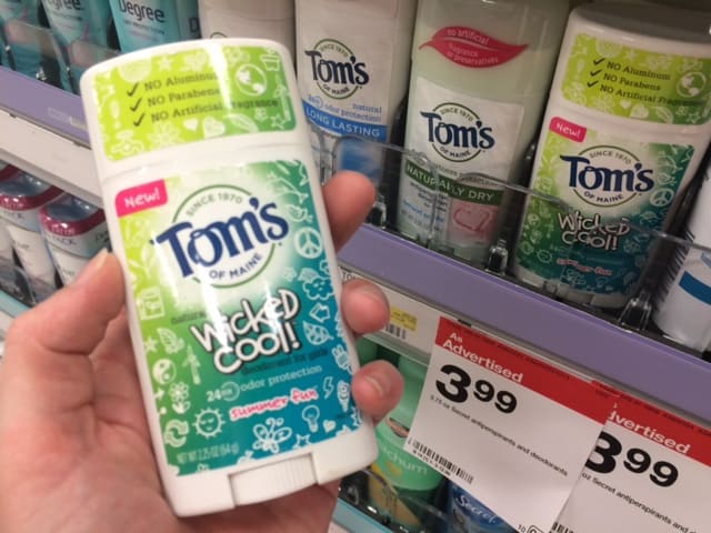 Image shows a hand holding Tom's of Maine deoderant