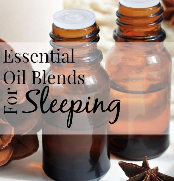 Image shows a close up of three amber bottles containing essential oils, with text that reads "Essential Oil Blends for Sleeping"