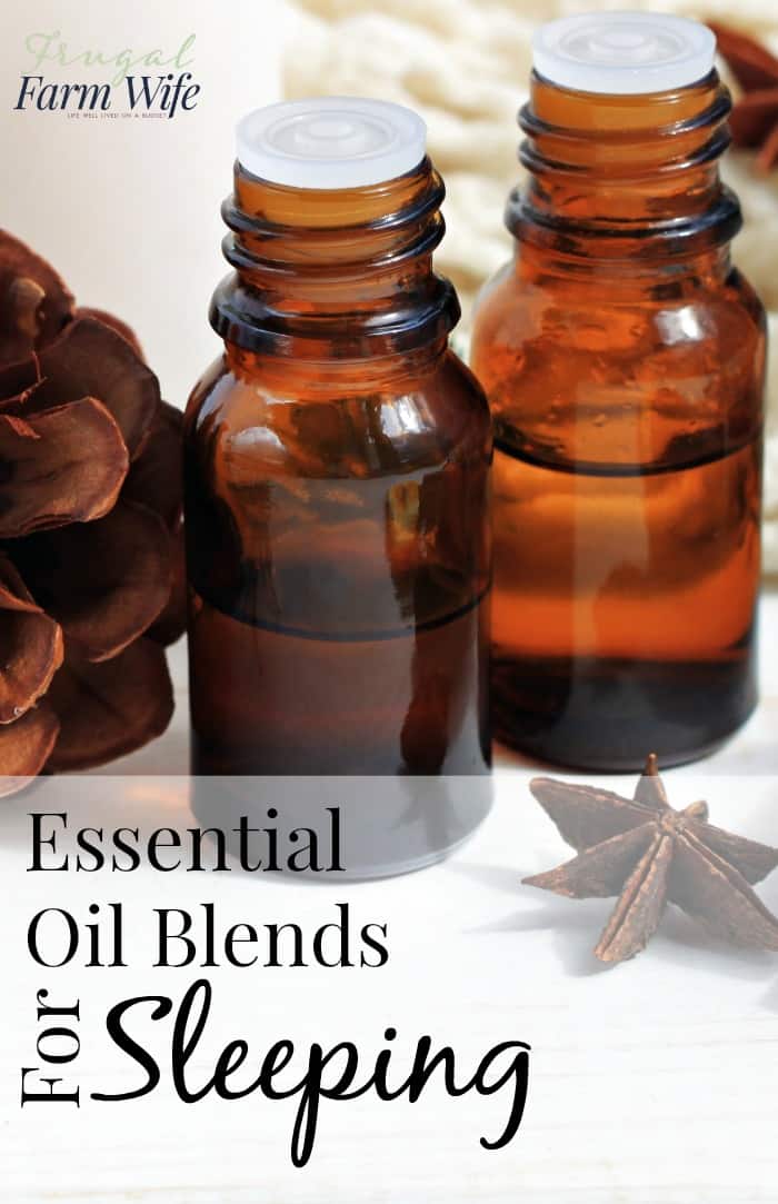 Image shows a close up of three amber bottles for essential oils with text overlay that reads "Essential Oil Blends for Sleeping"