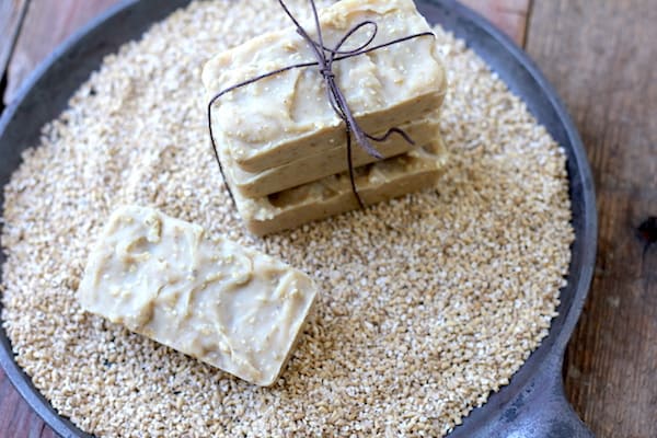 Image shows several bars of oatmeal soap in a iron skillet