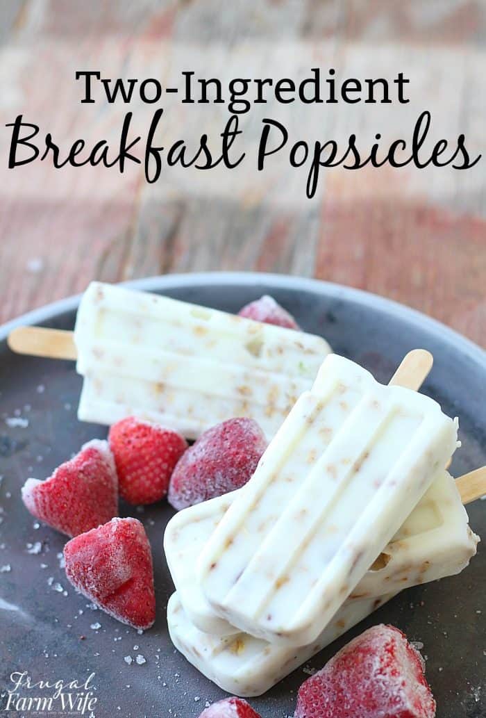 Image shows popsicles and berries on a plate with text that reads "Two-Ingredient Breakfast Popsicles" 