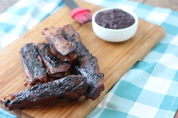 Image shows a cutting board with bbq pork spare ribs
