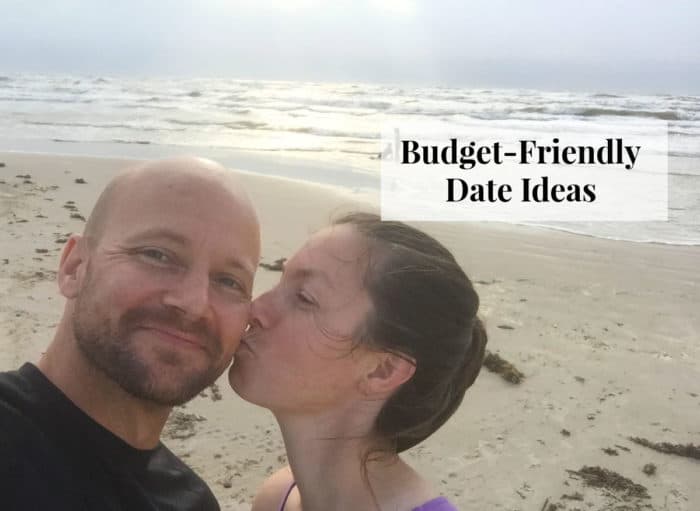 Image shows a man and woman standing on a beach with text that reads "Budget-Friendly Date Ideas"