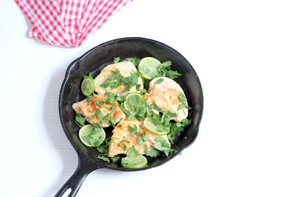 Photo shows a skillet of cilantro lime chicken