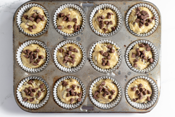 muffins in a muffin tin before baking