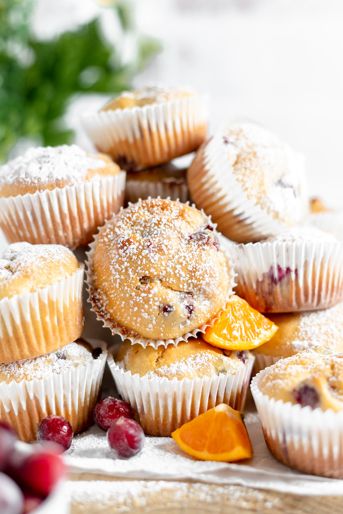 muffins, piled up with cranberries and orange slices