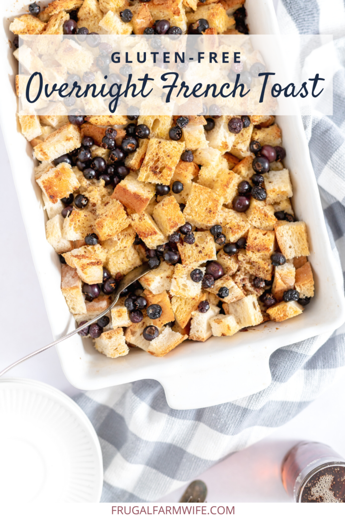gluten free french toast casserole in a baking dish with a spoon for serving.