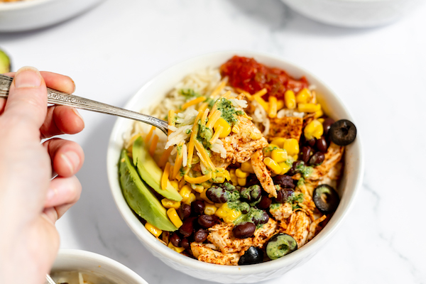 chicken, rice, salsa, avocado in a bowl