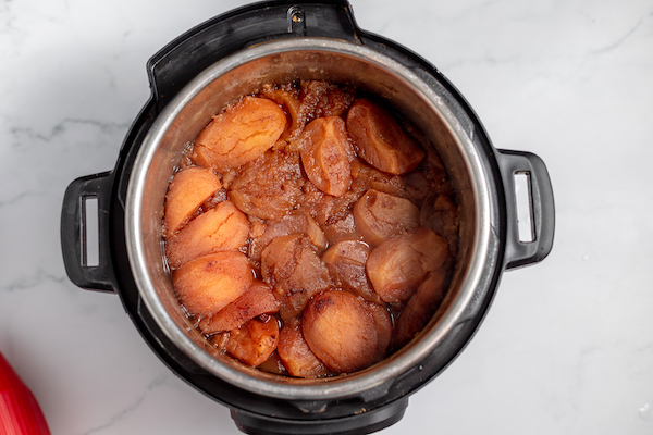 cooked apples with cinnamon and brown sugar.