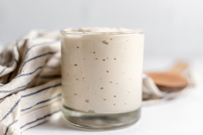 jar of sourdough starter ready to bake with