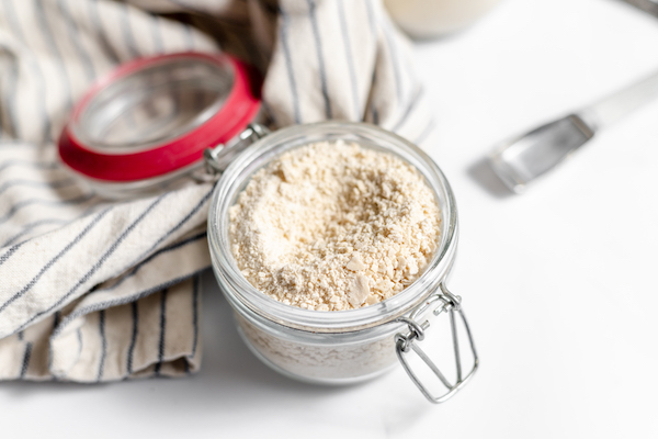 jar with dried sourdoughs tarter and measuring spoons