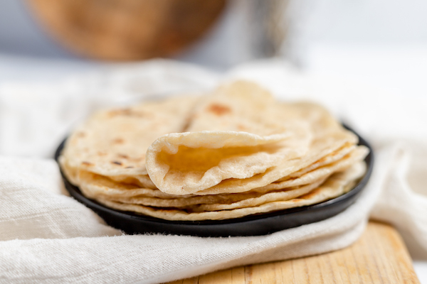 stack of sourdough tortillas on a plate